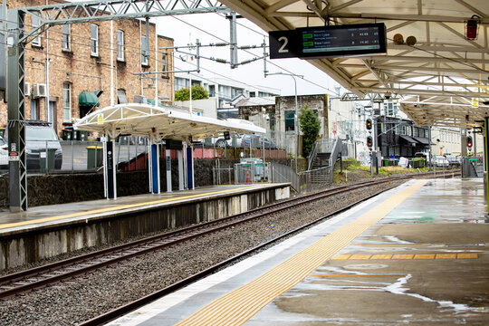 Train station platform soaked in the rain in Auckland, New Zealand