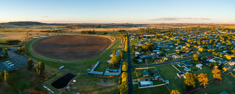 panoramic landscape of Glen Innes showing houses and racecourse at sunset  