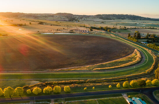 neat racetrack racecourse with tree lined road in rural landscape in NSW Australia 