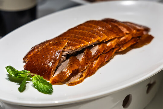 Serving of popular Peking Duck or Beijing duck, crispy skin roasted to perfection in restaurant China