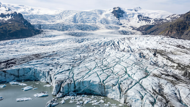 Majestic Ice Cap Landscape Revealing Intricate Glacier Patterns and Calm Water