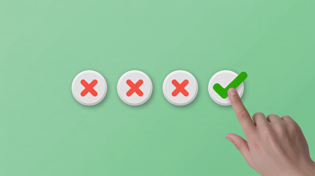 A hand selecting the correct option from a series of choices on a green background