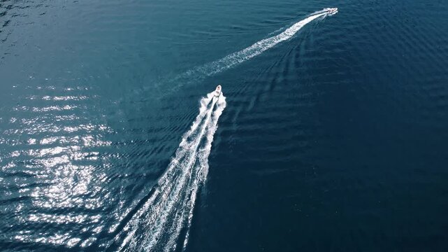 Fast boat ride. Speedy vessel slicing through water. Highspeed boat skimming across shimmering sea surface