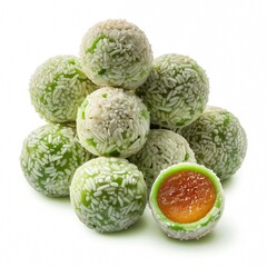 Obraz premium A delightful arrangement of vibrant green sweet confectionery, generously coated with white shredded coconut, featuring a rich, sweet fruit filling in one piece, perfect for dessert
