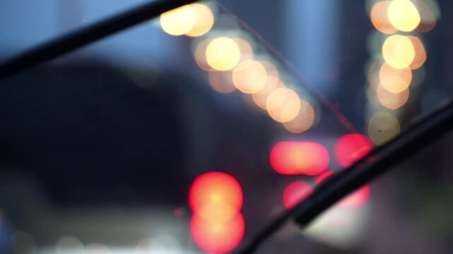 Inside view of driving a car in rain at night