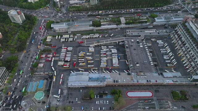 Aerial view of Seoul Express Bus Terminal at sunset with heavy traffic and city lights, Gangnam, South Korea.