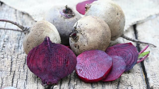 Fresh sliced beetroot on wooden surface. fresh beetroot on wooden background