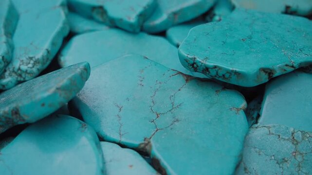 Turquoise stones displayed in a market basket