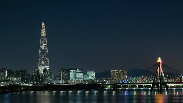 Day to night boomerang hyperlapse of Lotte World Tower and the Han River. Modern city cityscape with a parallax effect.