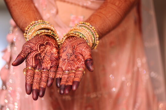 woman in mehendi hands an indian tatoo