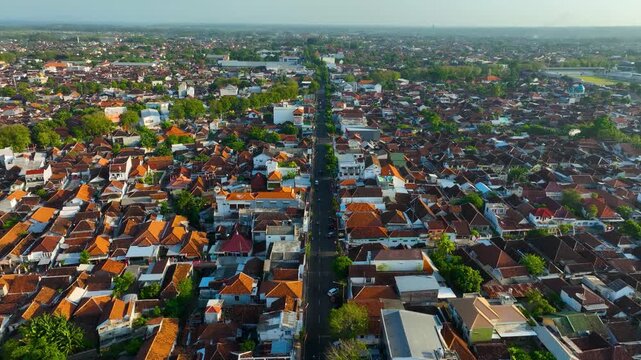 Flying Above Panglima Besar Sudirman Street In Dense Urban Area Of Banyuwangi, East Java, Indonesia. wide aerial shot