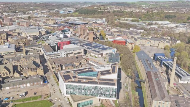 University of Huddersfield Queensgate Campus located on Queensgate near Huddersfield Narrow Canal in Kirklees West Yorkshire with modern academic buildings forming a compact city campus, drone shot