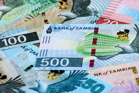 Zambian kwacha money banknotes pile on table. Zambia bills of ZMW currency close up
