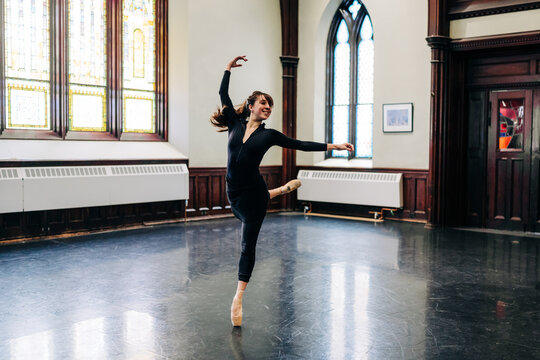 Ballet dancer on pointe in historic studio building