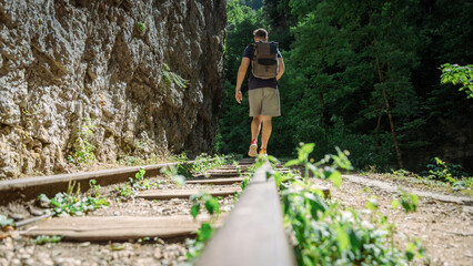 Fototapeta premium old railway without a train and without people in the forest in the mountains