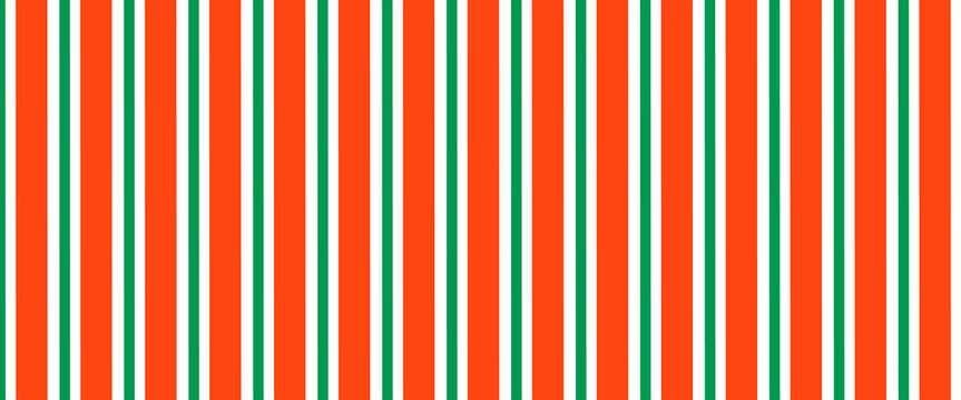 Christmas seamless pattern. Red and green diagonal stripes background. Candy cane repeating decoration wallpaper. Winter holiday lines backdrop. Xmas peppermint present wrapping print design. Vector