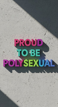 Colorful text "Proud to be Polysexual" on a light wall with shadow, representing identity and expression