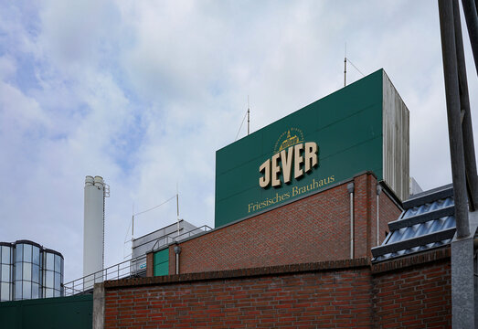 Jever, Lower Saxony, Germany. April 18, 2026. Jever beer brewery building with brand signage.Editorial and documentary use only