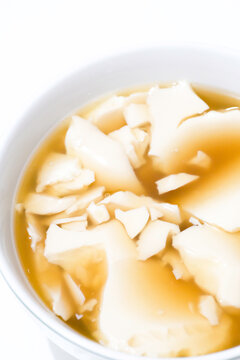 Kembang tahu is soybean pudding in ginger and palm sugar syrup, Indonesian traditional food