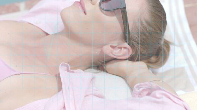 Woman reclining on towel, camera pan revealing shades while waveform and grid animate for fashion
