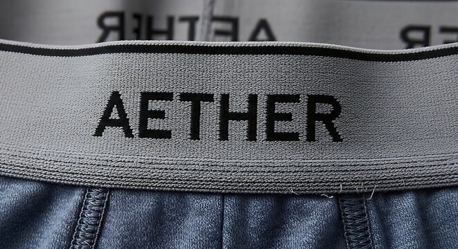 Close up view of the elastic waistband of Aether brand underwear.