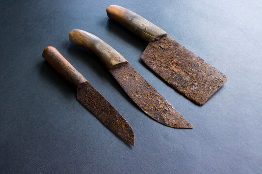 Rusty meat knife isolated on stone backgroundRusty meat knife isolated on stone background