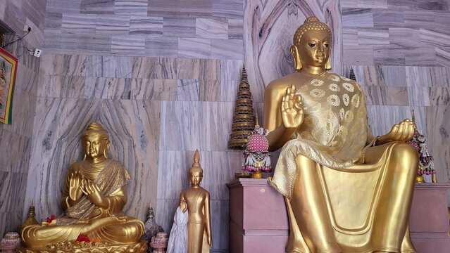 Wat Thai Sarnath temple with golden Thai architecture and Buddha statue near Varanasi, India
