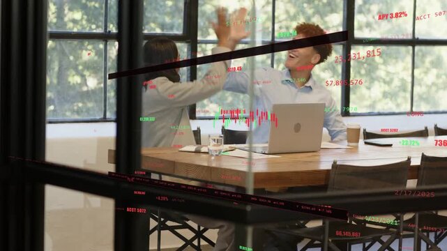 Woman taking notes and man reviewing laptop, spotting ticker overlay and celebrating finance win