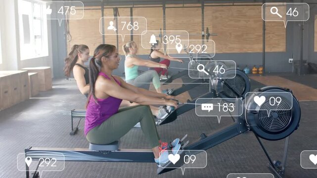 Lead rower starting four women rowing on machines for fitness while overlays covering rowers