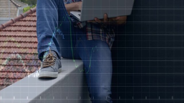 Man sitting ledge placing laptop, causing stock charts aligning with laptop and analyzing markets