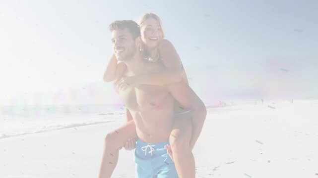 Man carrying woman walking bright shore, sunlight driving triangles over pair for travel ad