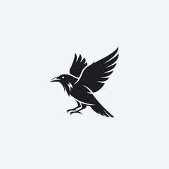 Obraz premium Silhouette of a Raven in Flight with Wings Spread Wide.