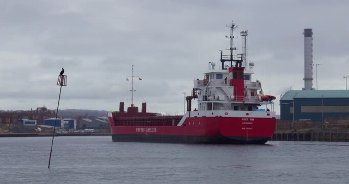 Wide shot of a large ship entering Shoreham harbour