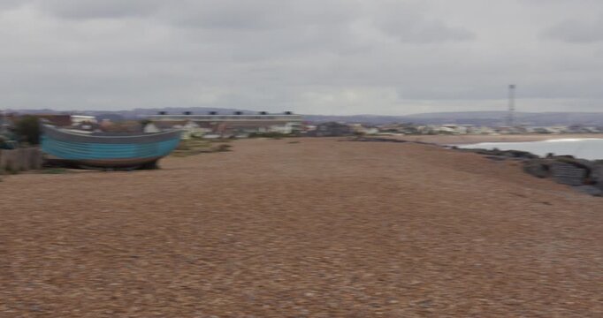 Panning shot of Shoreham beach from houses onto sea
