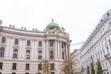 Historic neoclassical architecture along grand city street in Vienna. © mitarart