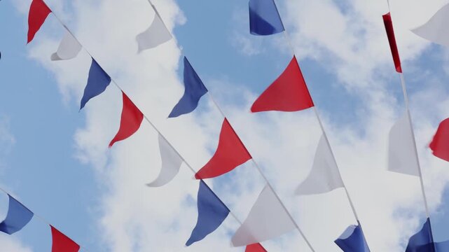 Colorful Triangular Pennant Flags Against a Blue Sky