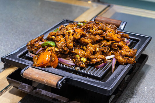 Delicious spicy Chinese lamb with black peppar and cumin served on hot plate