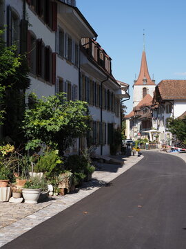 Alley with German church in town of Murten in Switzerland - vertical