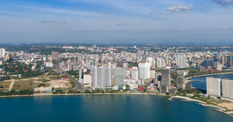 Obraz premium The high-rise office buildings of Sihanoukville, a coastal city, are captured from a drone.