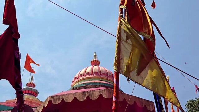 Yerad's Yedoba Temple shines during Chaitra Yatra. Sasan kathis & bright flags sway as gulal fills the air. The Chhabina procession celebrates local heritage beneath the temple&rsquo;s iconic sacred kalash.