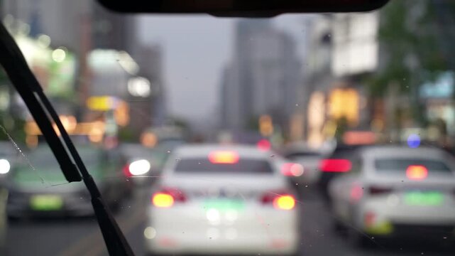 Inside view of driving a car in rain at night
