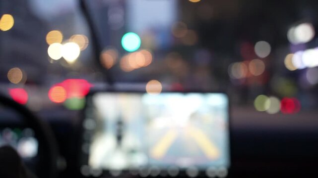 Inside view of driving a car in rain at night
