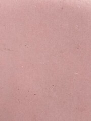 Fototapeta premium Macro close up shot of smooth pink processed meat surface showing fine grain texture and natural pores in even lighting for culinary backgrounds and food design