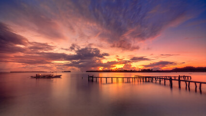 Beautiful colorful sunset on the seashore with fishing boats. Philippines, Siargao Island. © Footage pro plus
