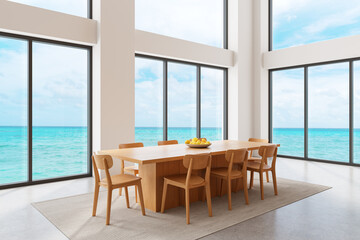 Fototapeta premium Modern coastal interior dining room with large windows overlooking turquoise ocean and wooden furniture bathed in natural light. 3D Rendering