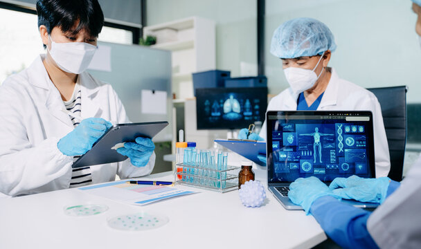 Scientists conducting laboratory research, analyzing samples in a biotech lab. Healthcare innovation, medical testing, and advanced science technology