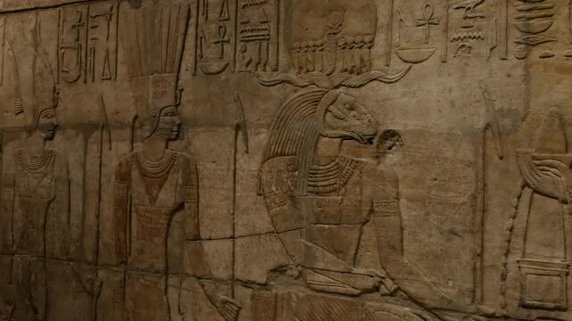 An an ancient egyptian tomb with art and releifs with hyroglyphics