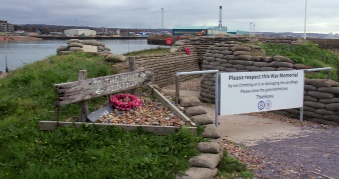 Wide panning shot right to left of the entrance to a War Memorial set up as a World War One trench. At Shoreham Fort