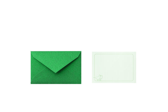 A glitter green envelope, viewed from above, with a light green card featuring a line frame and birds illustration.	