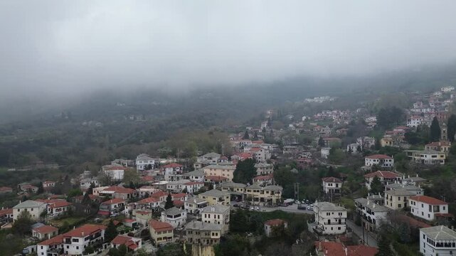 Aerial view of Portaria traditional village on Mount Pelion, Greece, with stone houses and lush green landscape